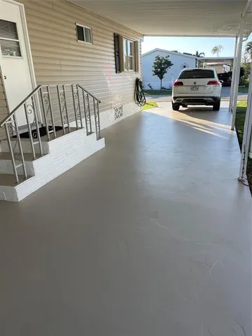 a view of a car park in front of a house