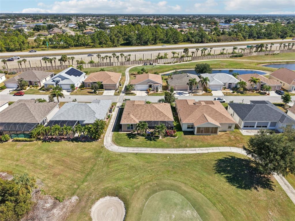 24567 Buckingham Way Punta Gorda, FL 33980 - Photo 45 of 46 an aerial view of residential houses with outdoor space and swimming pool