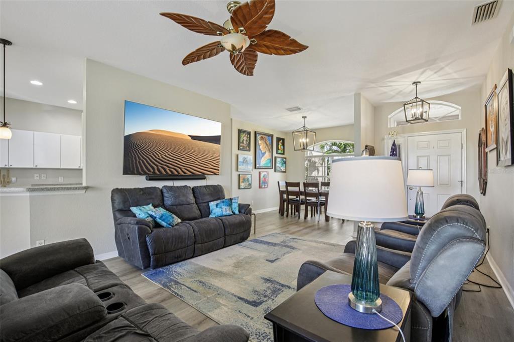 24567 Buckingham Way Punta Gorda, FL 33980 - Photo 7 of 46 a living room with furniture and wooden floor
