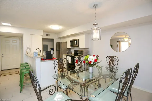 a view of a dining room and a livingroom