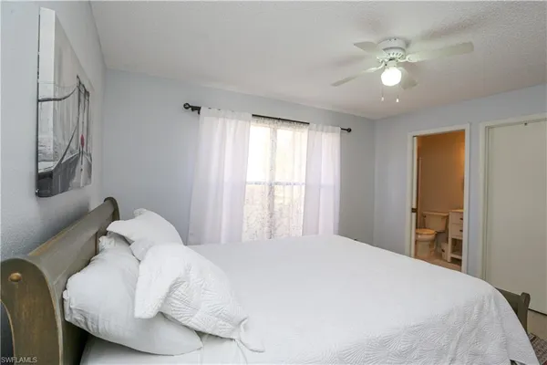a large white bed in a white room