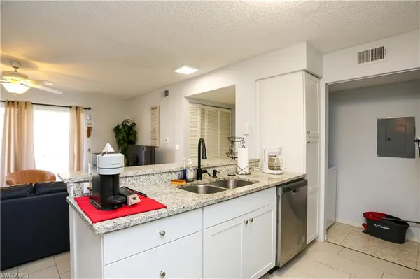 a kitchen with a sink and cabinets