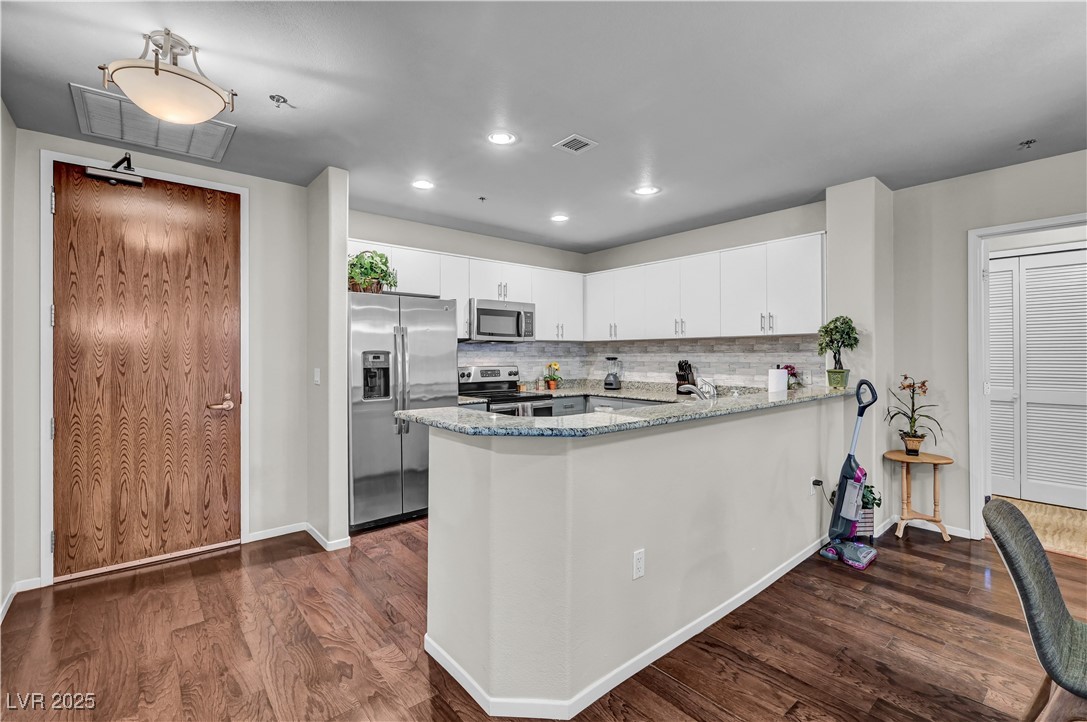 8255 South Las Vegas Boulevard, Unit 1715 Las Vegas, NV 89123 - Photo 8 of 49 Breakfast bar easily accommodates 3-4 barstools.