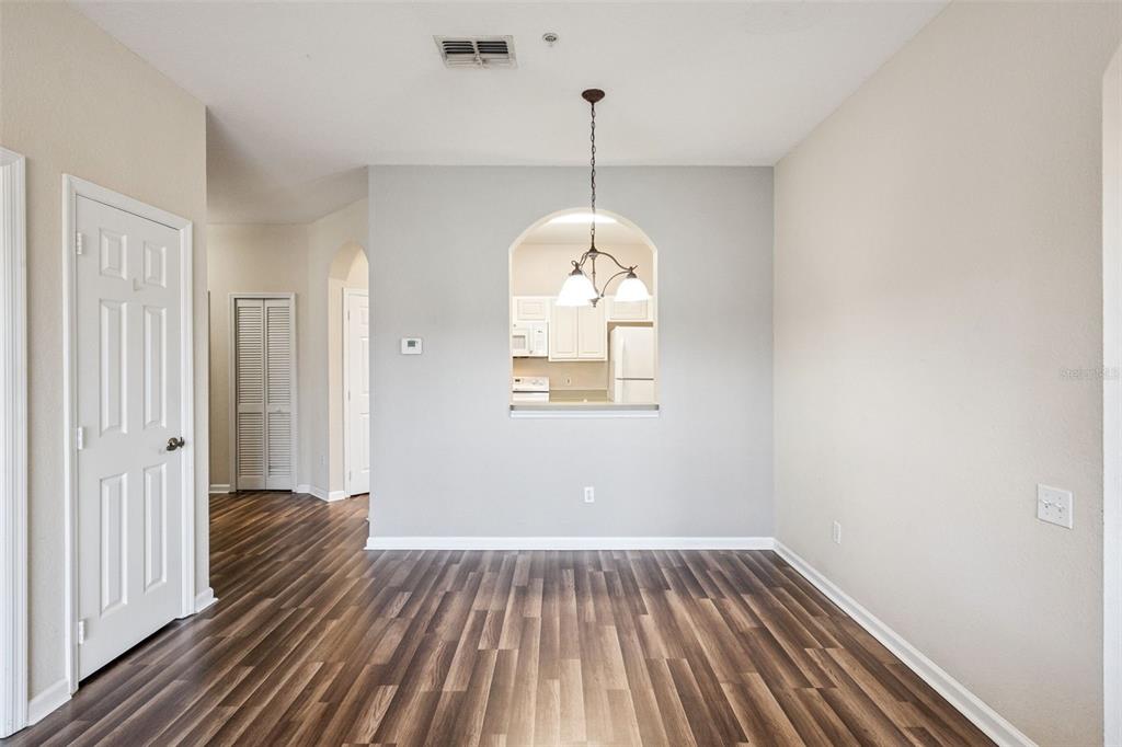 13560 Turtle Marsh Loop, Unit 21 Orlando, FL 32837 - Photo 11 of 30 a view of a room with wooden floor and entryway
