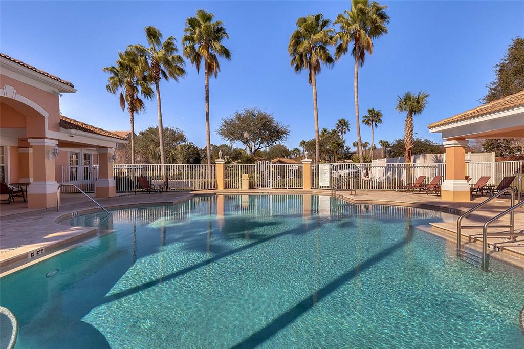 13560 Turtle Marsh Loop, Unit 21 Orlando, FL 32837 - Photo 29 of 30 a view of a swimming pool with a garden