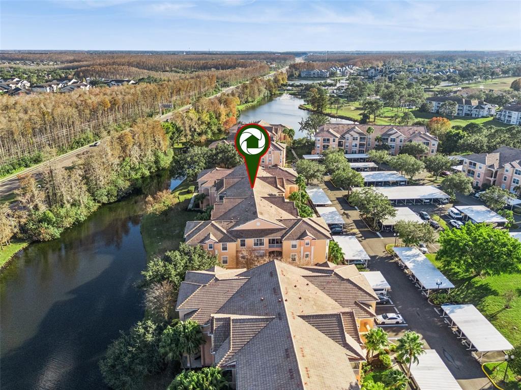 13560 Turtle Marsh Loop, Unit 21 Orlando, FL 32837 - Photo 4 of 30 an aerial view of residential houses with outdoor space and river
