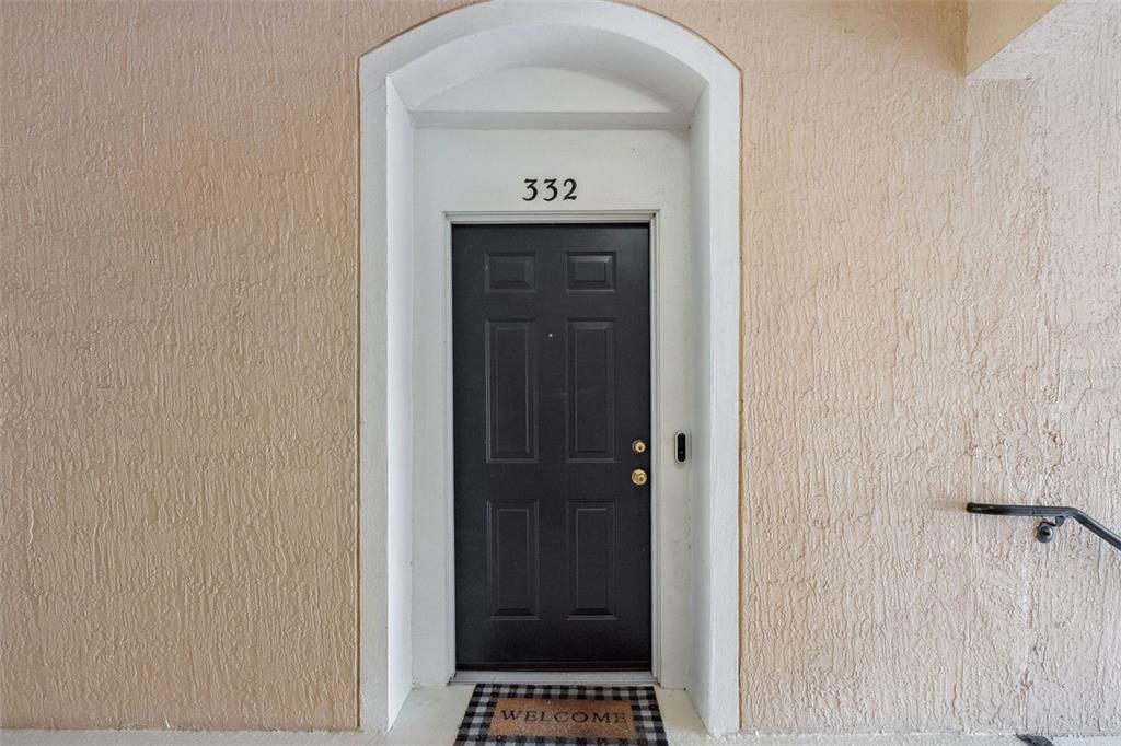 13560 Turtle Marsh Loop, Unit 21 Orlando, FL 32837 - Photo 5 of 30 a view of a hallway with wooden door