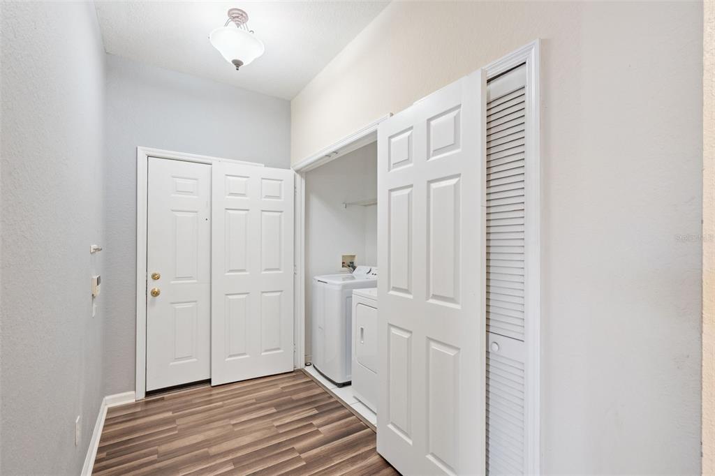 13560 Turtle Marsh Loop, Unit 21 Orlando, FL 32837 - Photo 6 of 30 a view of a hallway with wooden floor