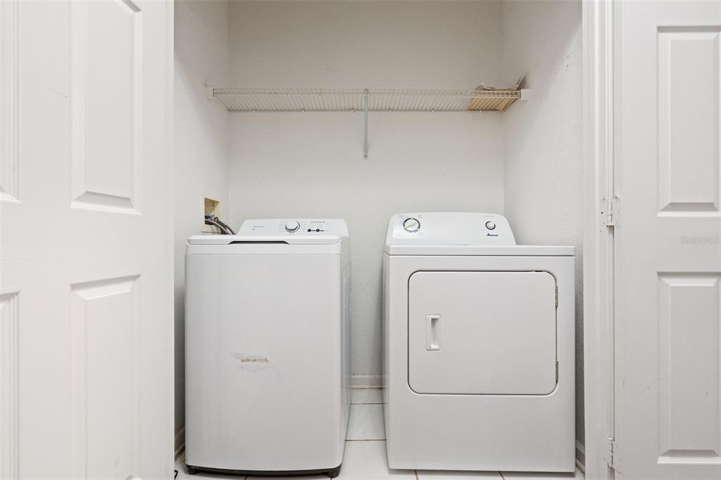 13560 Turtle Marsh Loop, Unit 21 Orlando, FL 32837 - Photo 7 of 30 a utility room with dryer and washer