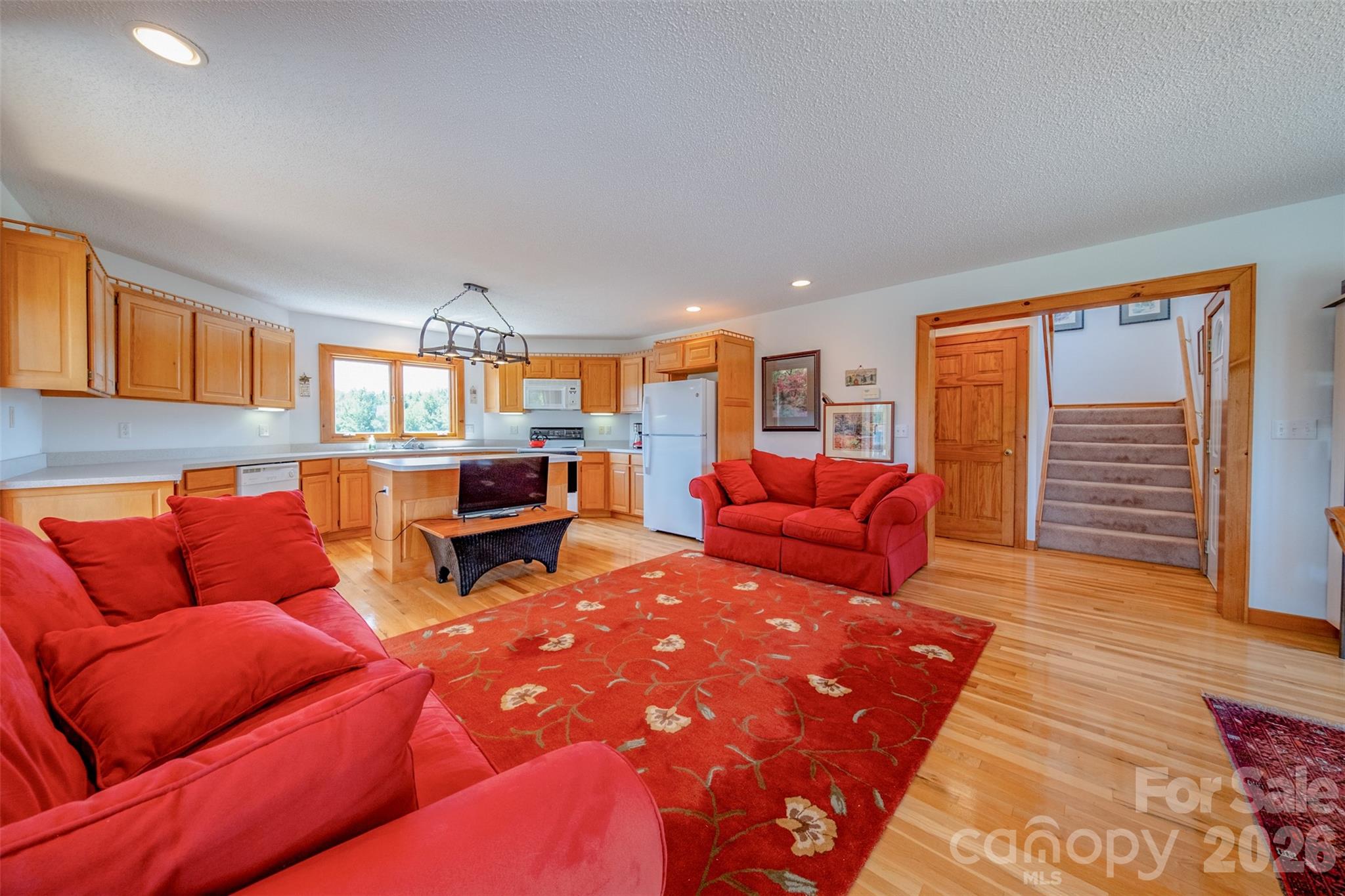 216 Deer Track Lane Sparta, NC 28675 - Photo 22 of 44 a living room with furniture and a wooden floor