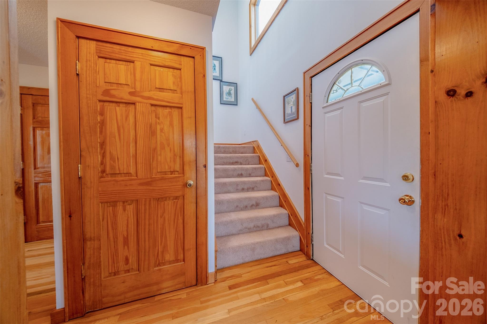 216 Deer Track Lane Sparta, NC 28675 - Photo 23 of 44 a view of a hallway with wooden floor and entryway