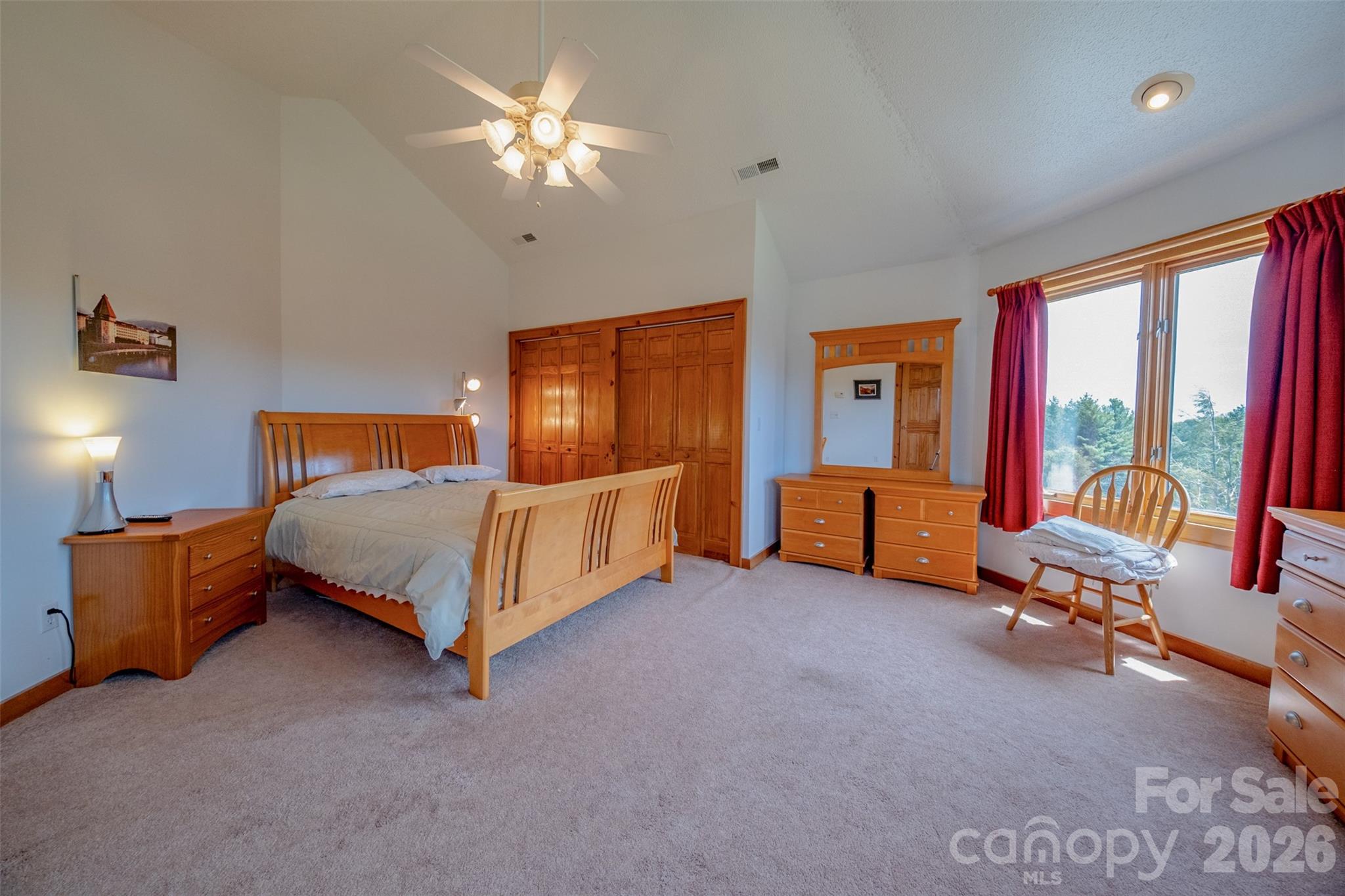 216 Deer Track Lane Sparta, NC 28675 - Photo 34 of 44 a bedroom with a bed and ceiling fan