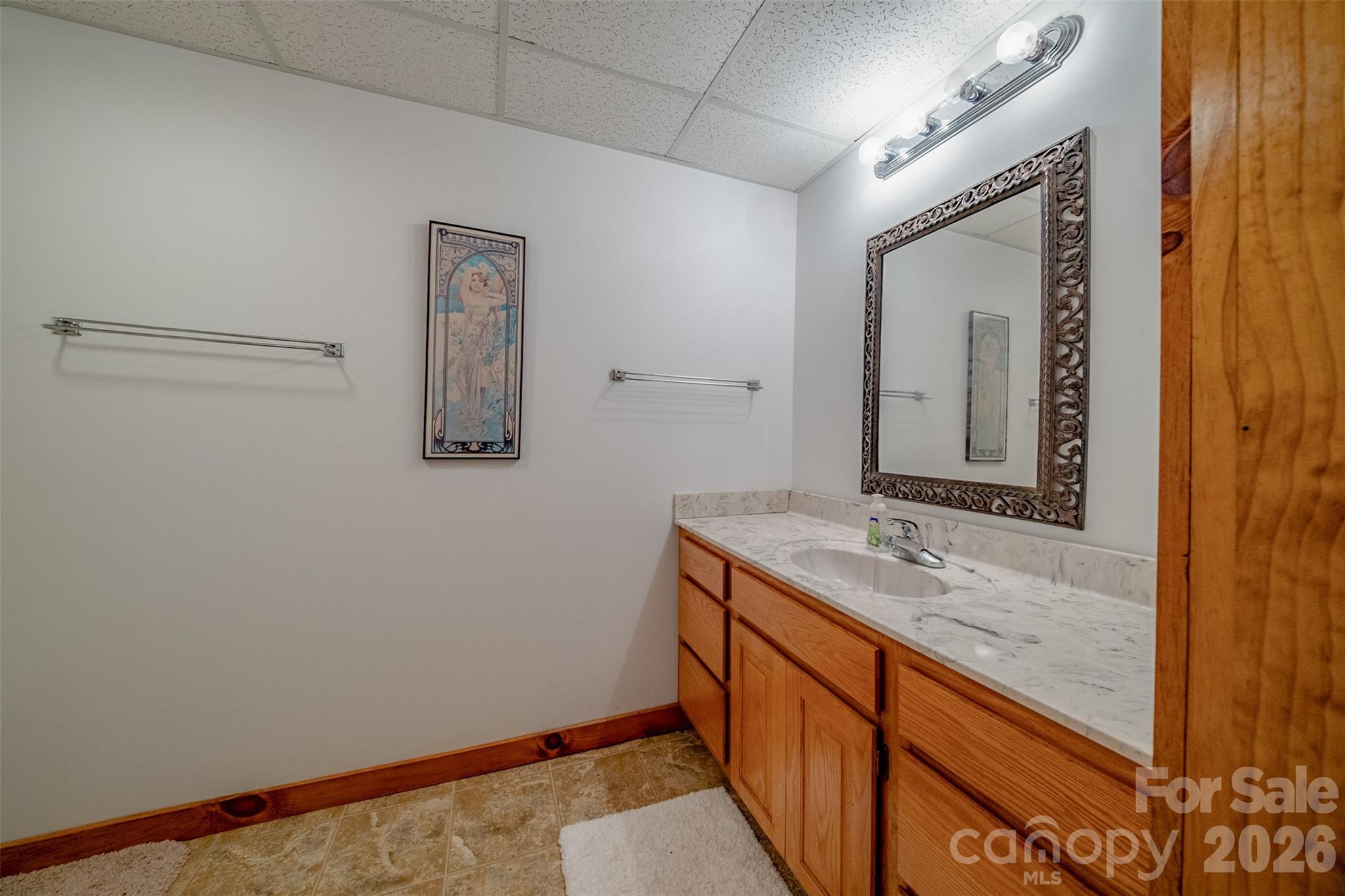 216 Deer Track Lane Sparta, NC 28675 - Photo 43 of 44 a bathroom with a sink and a mirror
