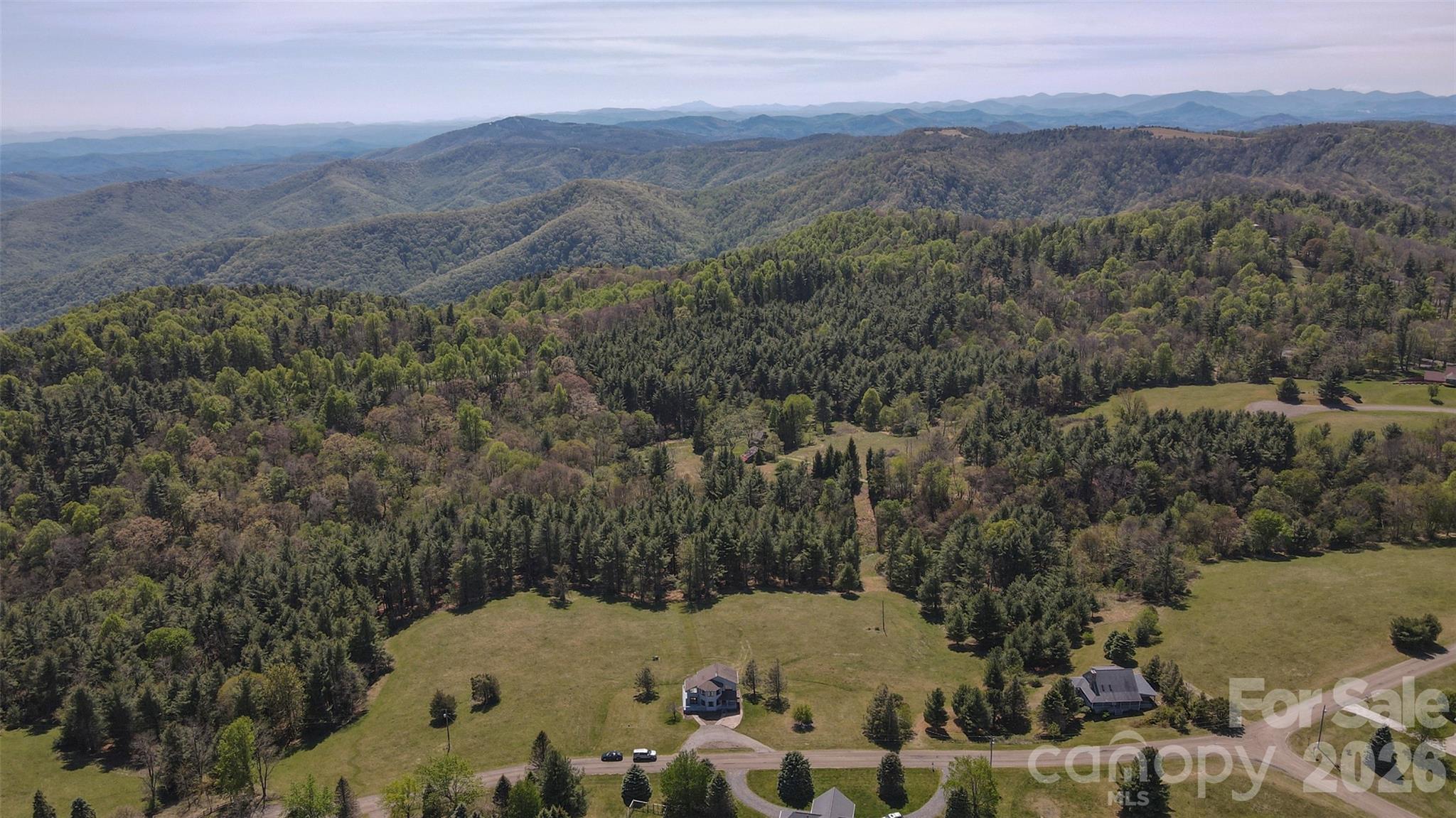 216 Deer Track Lane Sparta, NC 28675 - Photo 5 of 44 a view of a mountain from a yard