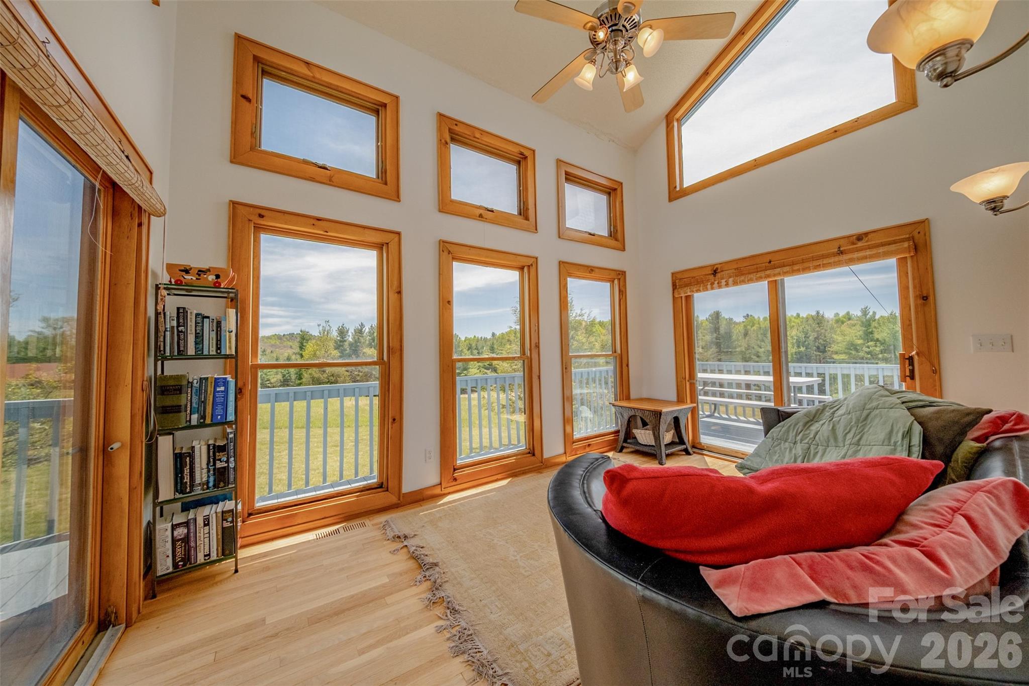 216 Deer Track Lane Sparta, NC 28675 - Photo 10 of 44 a living room filled with furniture and a floor to ceiling window