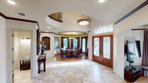 a view of living room with furniture and wooden floor