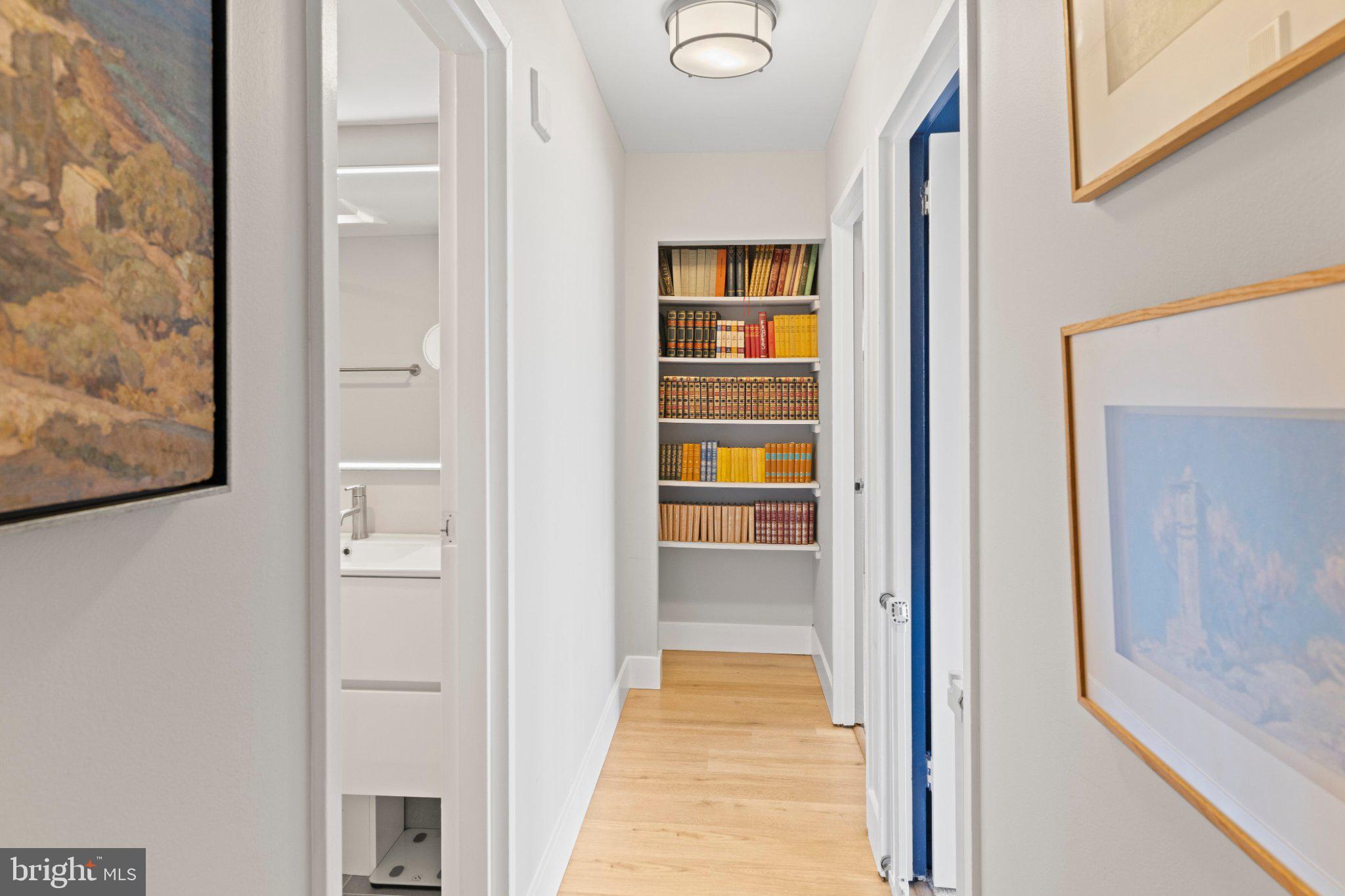 2001 Hamilton Street, Unit 1119 Philadelphia, PA 19130 - Photo 11 of 44 Charming hallway with cozy bookshelves.