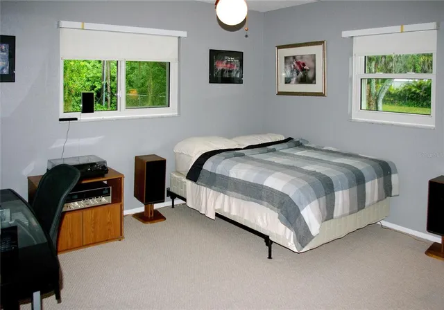 a bedroom with bed and a window
