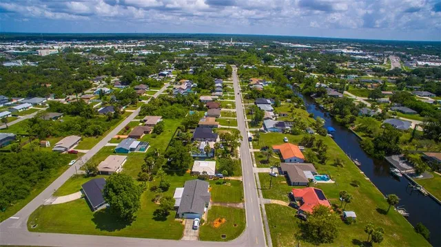 an aerial view of residential building and car parked