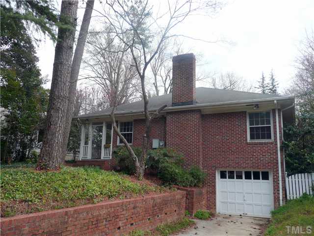 1706 Pineview Street Raleigh, NC 27608 - Photo 1 of 12 a front view of a house with garden