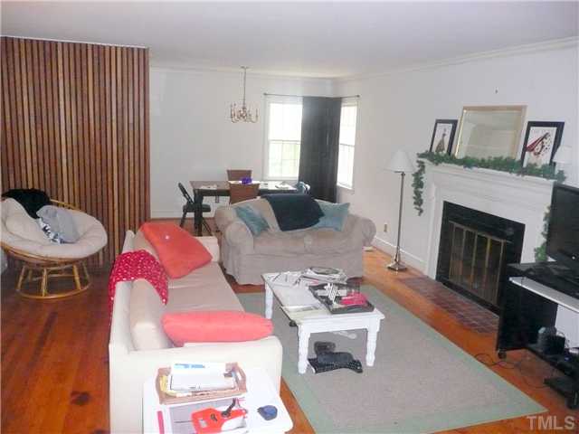 1706 Pineview Street Raleigh, NC 27608 - Photo 3 of 12 a living room with furniture and a fireplace