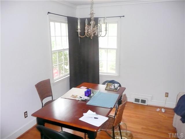 1706 Pineview Street Raleigh, NC 27608 - Photo 4 of 12 a view of a dining room with furniture and window