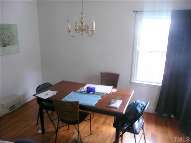 1706 Pineview Street Raleigh, NC 27608 - Photo 5 of 12 a view of a dining room with furniture and wooden floor