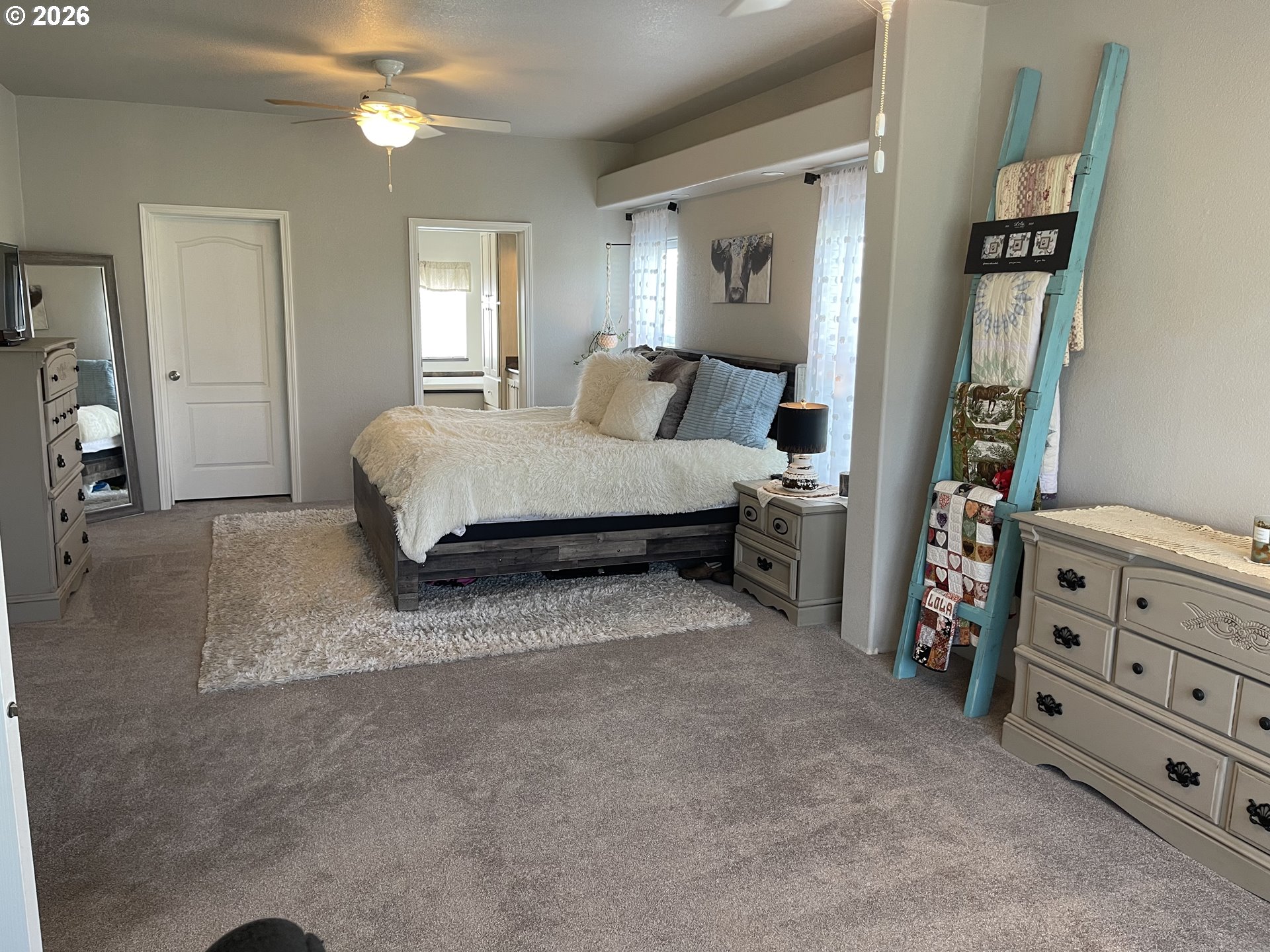 6404 Lookingglass Road Roseburg, OR 97471 - Photo 17 of 48 a spacious bedroom with a bed and furniture