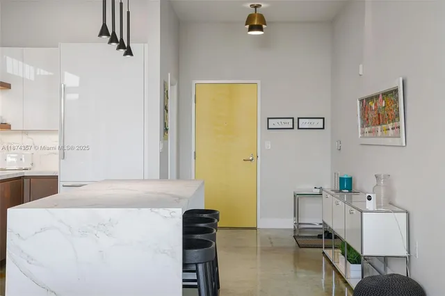 a bedroom with a bed and a table in it