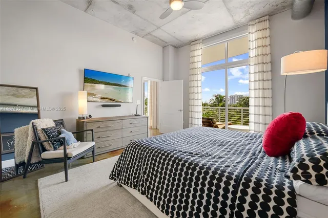 a bedroom with a bed and chair