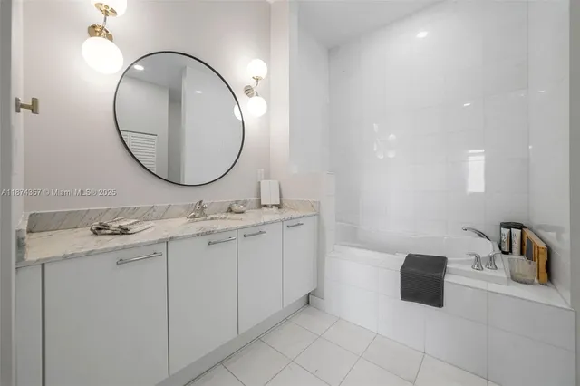 a bathroom with a double vanity sink and a mirror