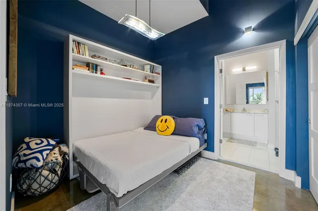 a bedroom with bed and a window