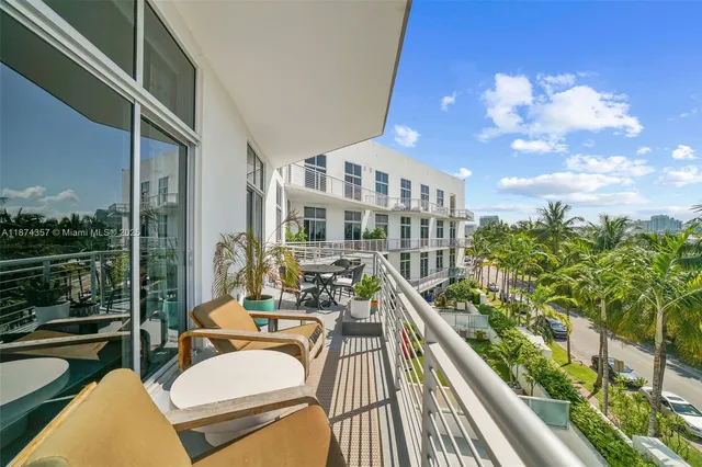 a view of balcony with furniture