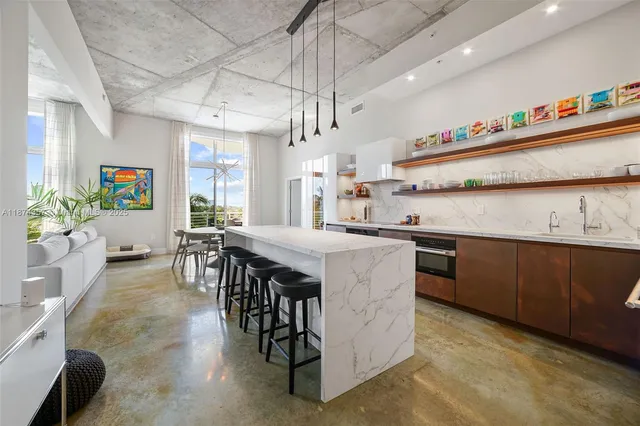 a kitchen with kitchen island granite countertop lots of counter top space