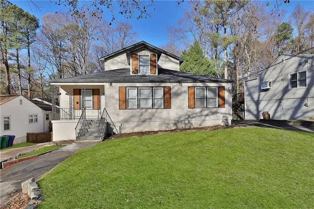 a front view of a house with a yard