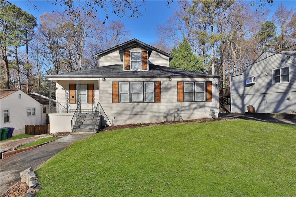 a front view of a house with a yard
