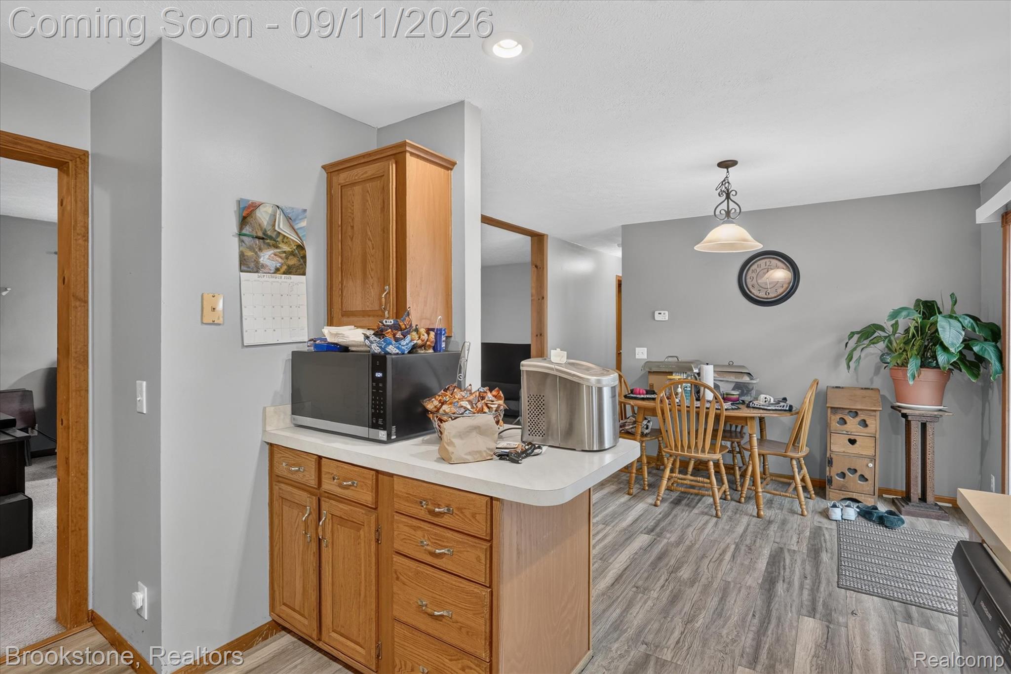 1812 South Steel Road Merrill, MI 48637 - Photo 13 of 39 Wood-finish flooring throughout, light oak cabinetry, and recessed lighting