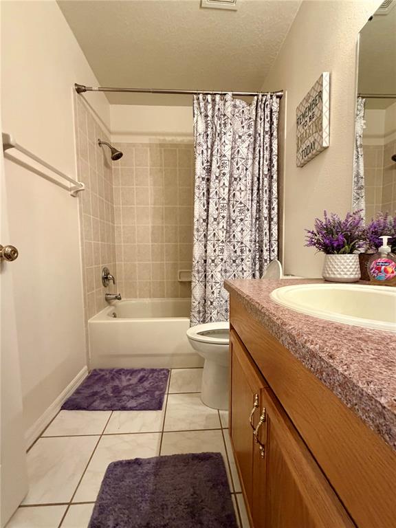 4303 Orange Ridge Court Valrico, FL 33596 - Photo 9 of 40 a bathroom with a granite countertop sink a toilet and shower