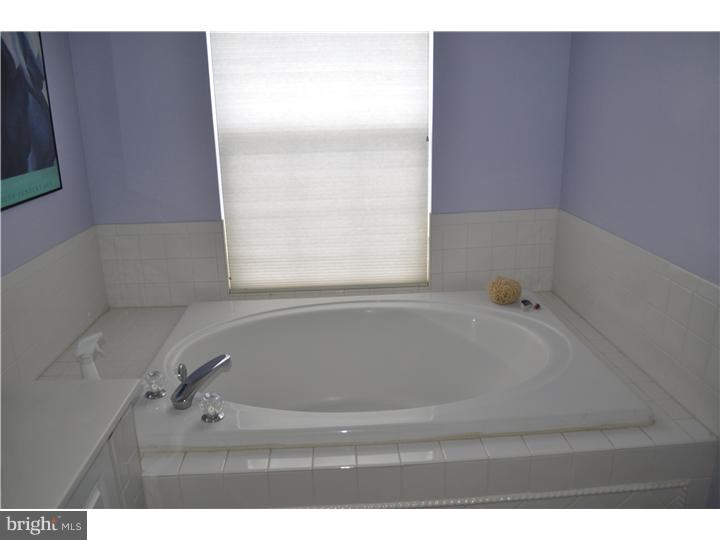 5 Coburn Road Pennington, NJ 08534 - Photo 17 of 25 a bathroom with a bathtub