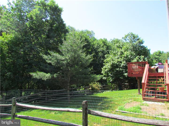 5 Coburn Road Pennington, NJ 08534 - Photo 24 of 25 a view of a backyard with wooden fence