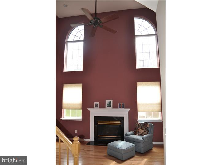 5 Coburn Road Pennington, NJ 08534 - Photo 10 of 25 a living room with furniture and a fireplace