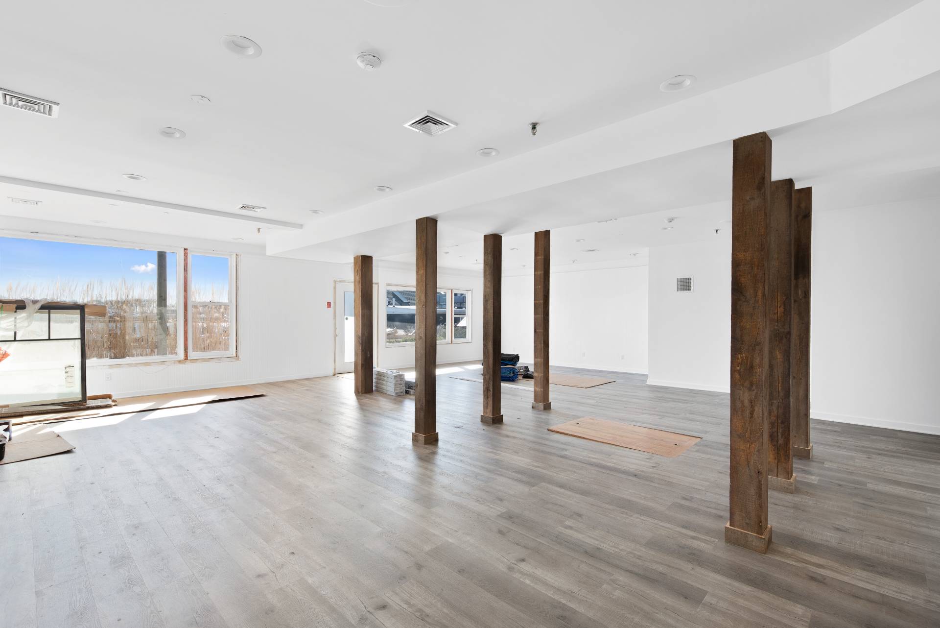 478 West Lake Drive Montauk, NY 11954 - Photo 4 of 10 a view of an empty room with wooden floor and a window