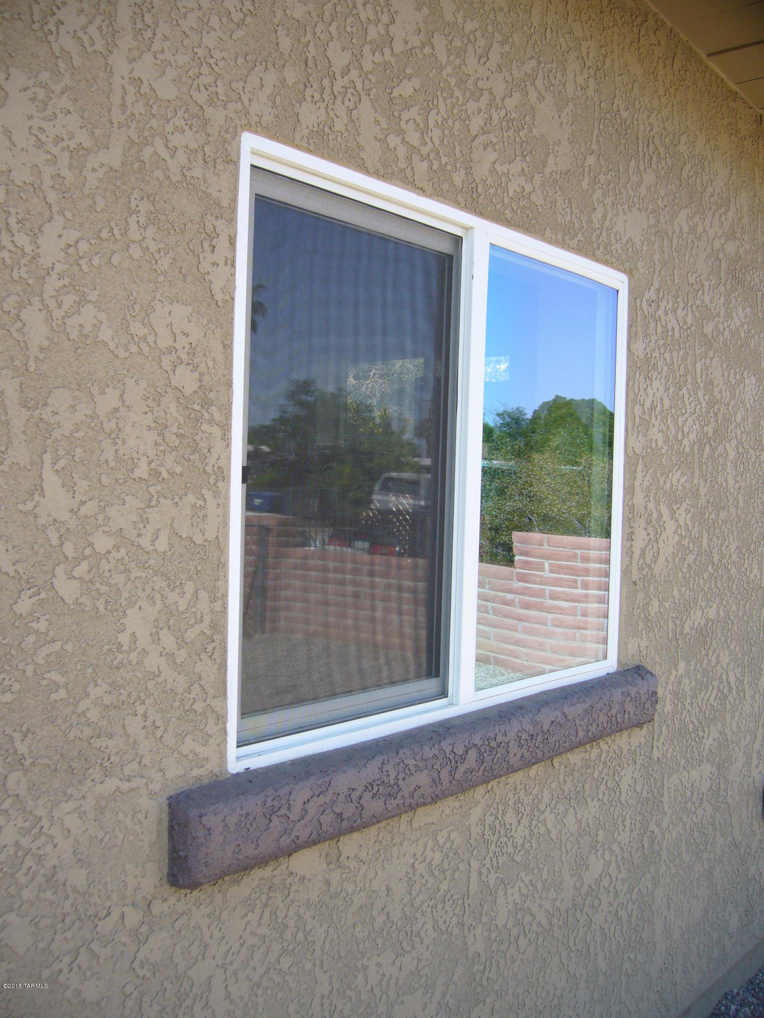 1243 West Kleindale Road Tucson, AZ 85705 - Photo 44 of 46 a view of a room that has a large window