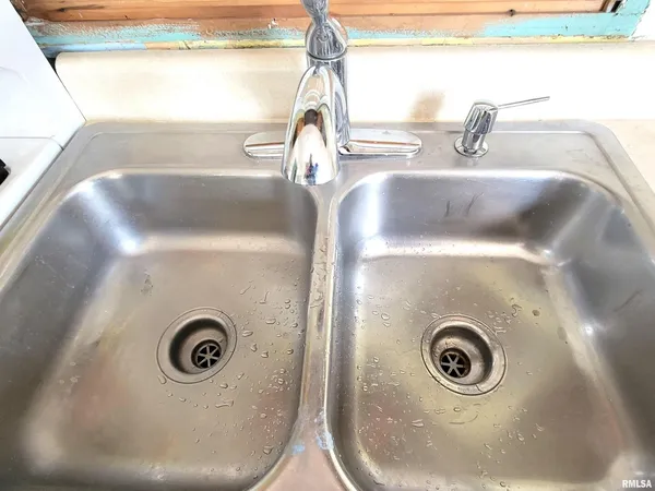 a kitchen with a stove a sink and a refrigerator