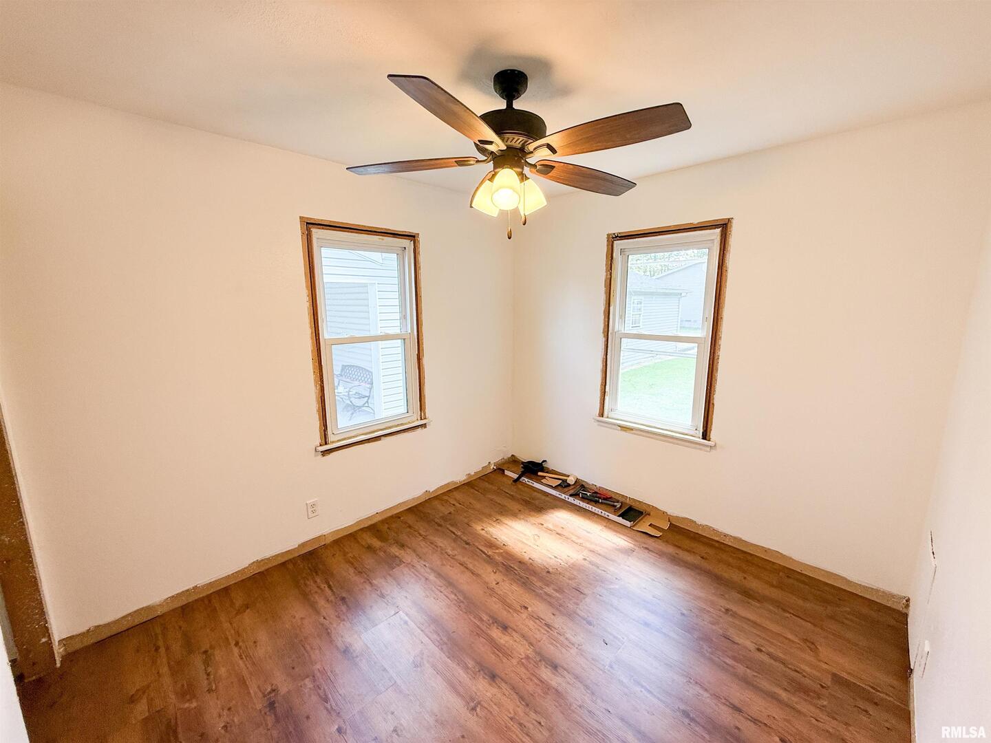 225 Hickory Street Flora, IL 62839 - Photo 35 of 56 a view of an empty room with window and wooden floor