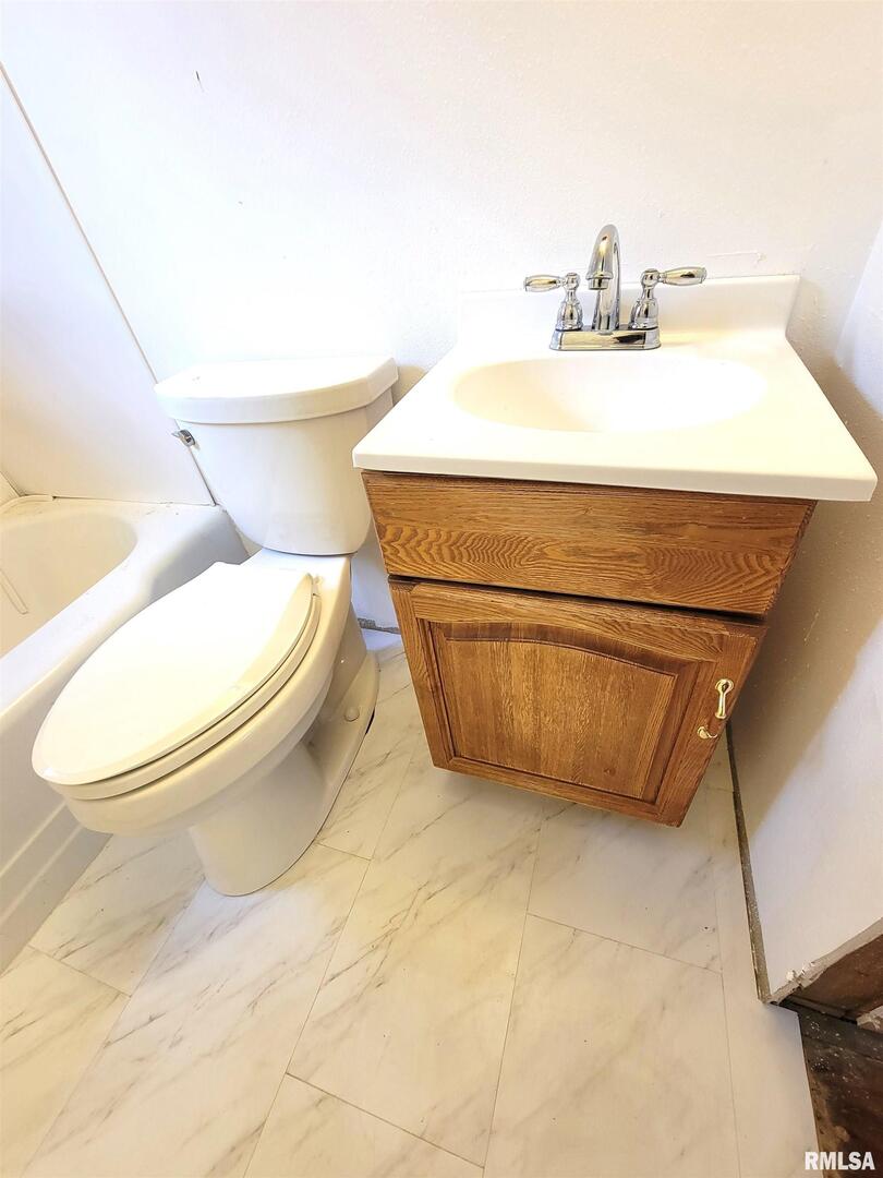 225 Hickory Street Flora, IL 62839 - Photo 44 of 56 a bathroom with a toilet and a sink