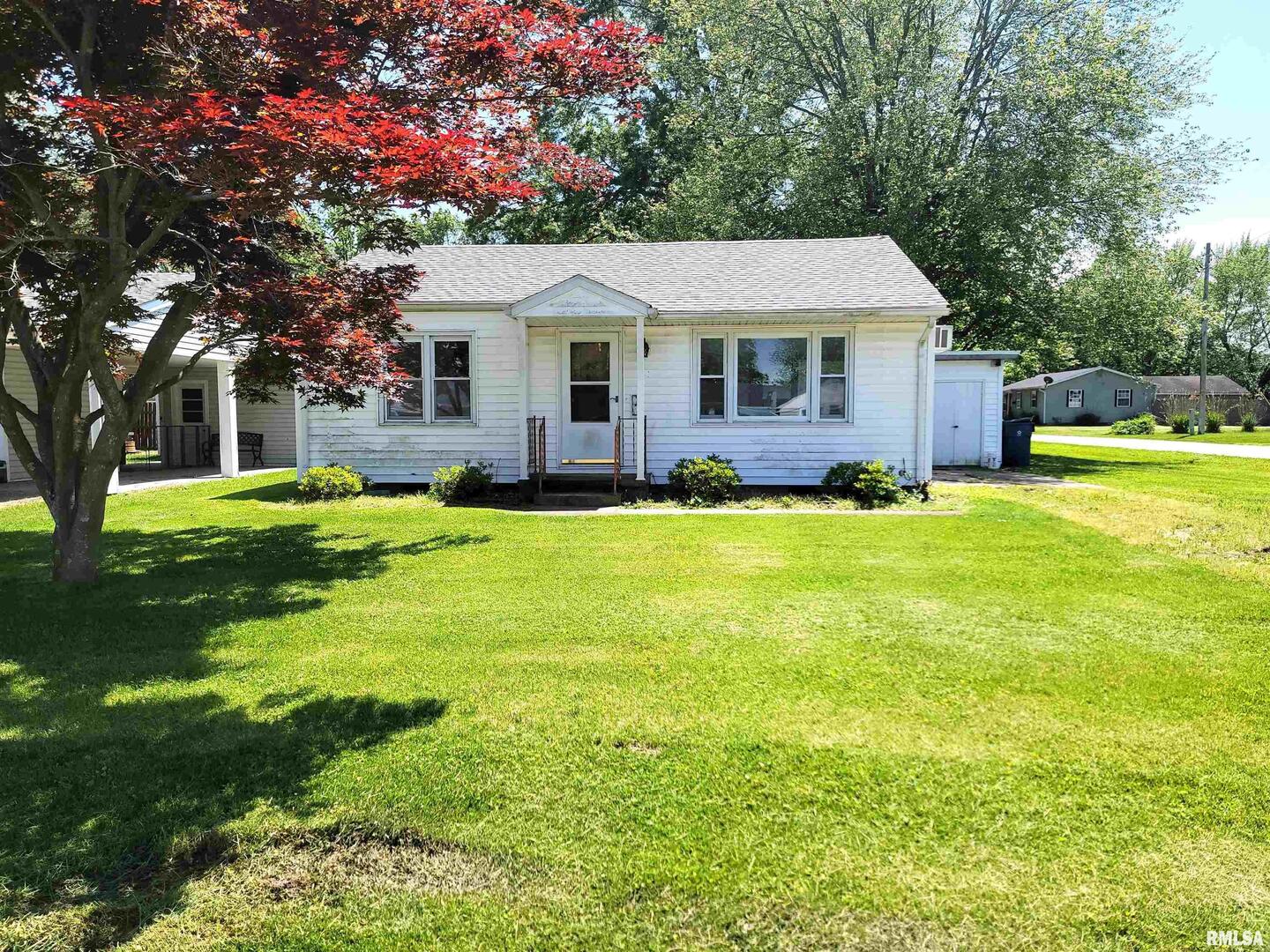 225 Hickory Street Flora, IL 62839 - Photo 56 of 56 a aerial view of a house with swimming pool and yard