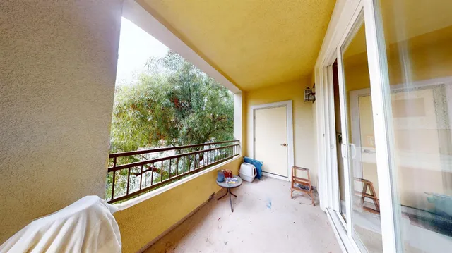 a view of a balcony with chair