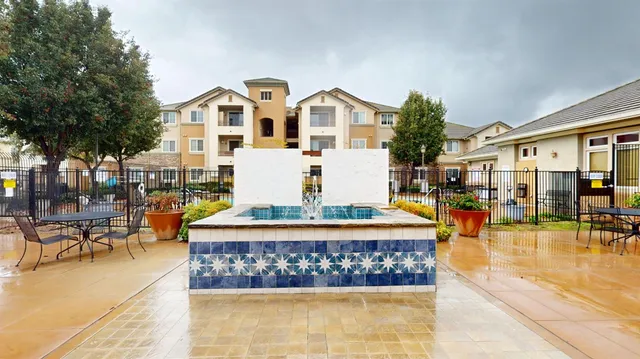a front view of a building with swimming pool