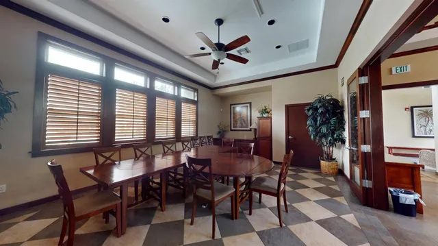 a view of a dining room with furniture and window